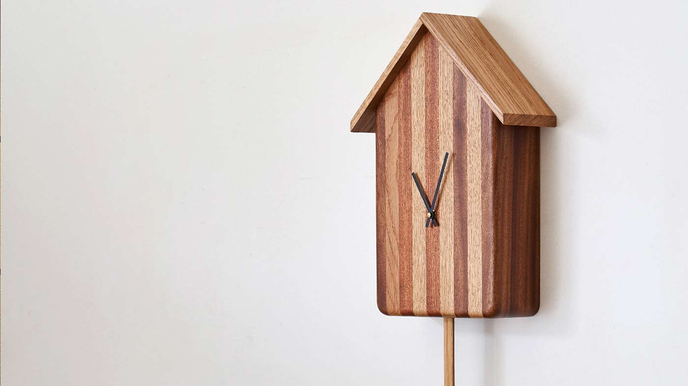 Oak Cuckoo Clock hanging on the wall