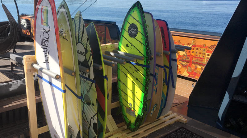 Our wooden surf racks on the deck of a yacht