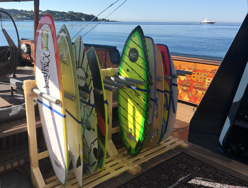 Our wooden surf racks on the deck of a yacht