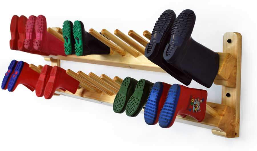 Wall mounted school and nursery children's boot rack in use