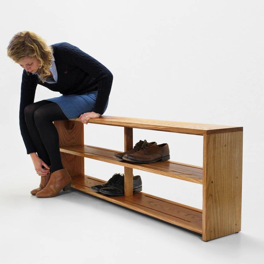 Oak Shoe Bench in use. Bench seat with footwear storage below.