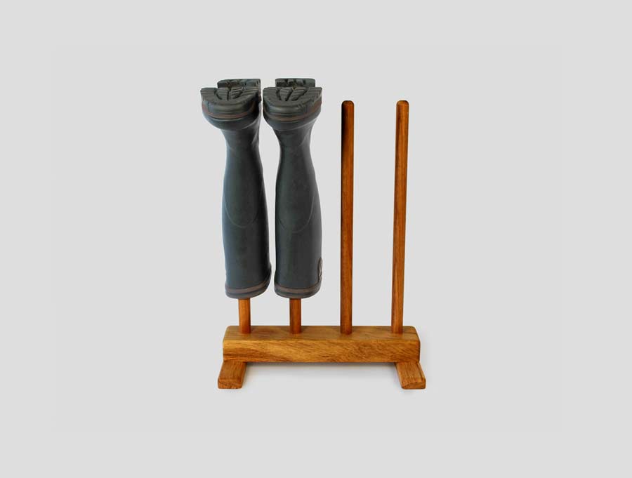 An Oak Wellington Rack with a pair of welly boots on it, part of our Wooden Footwear Storage Collection